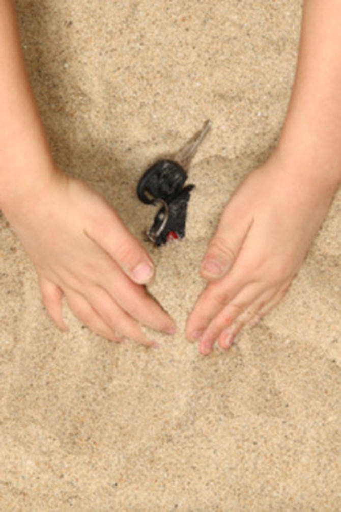 Lost car keys in sand