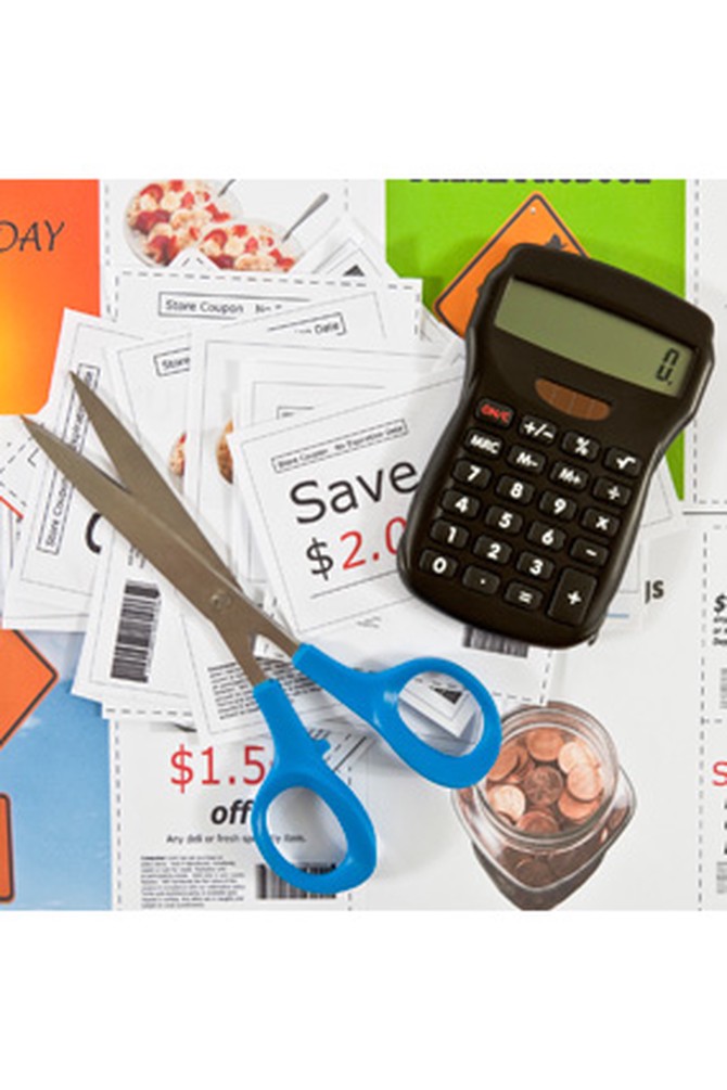 calculator, scissors and coupons