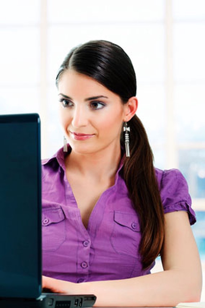 Woman working at laptop computer