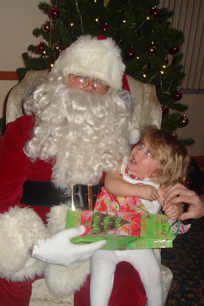 Screaming child on Santa's lap