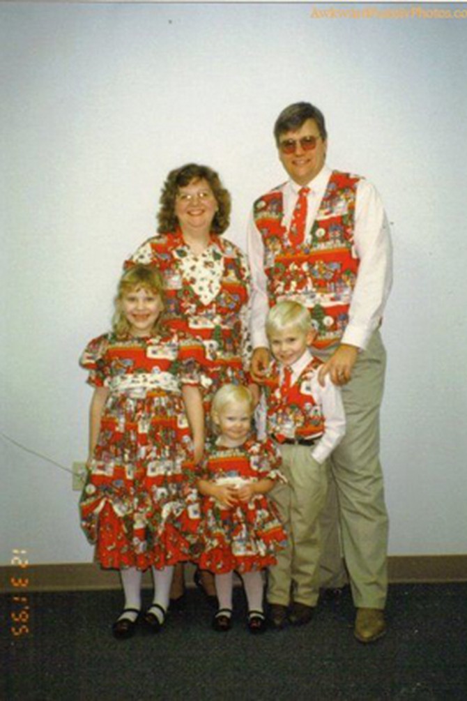 Family in Christmas vests
