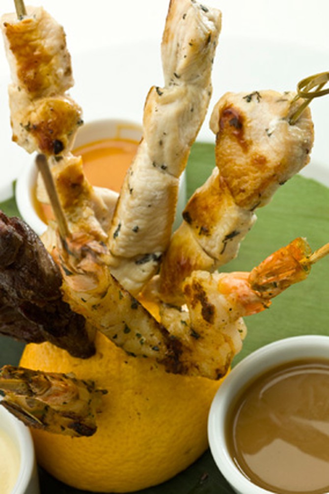 Chicken skewers and assorted dipping sauces