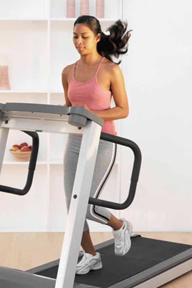 Woman Running on Indoor Treadmill
