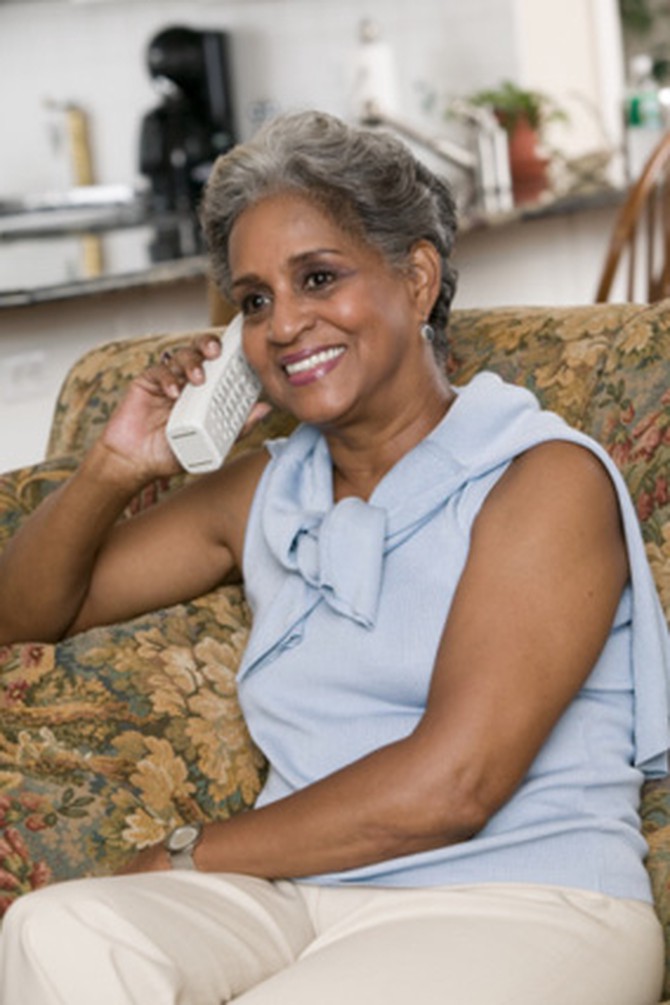 Gray-haired woman on phone