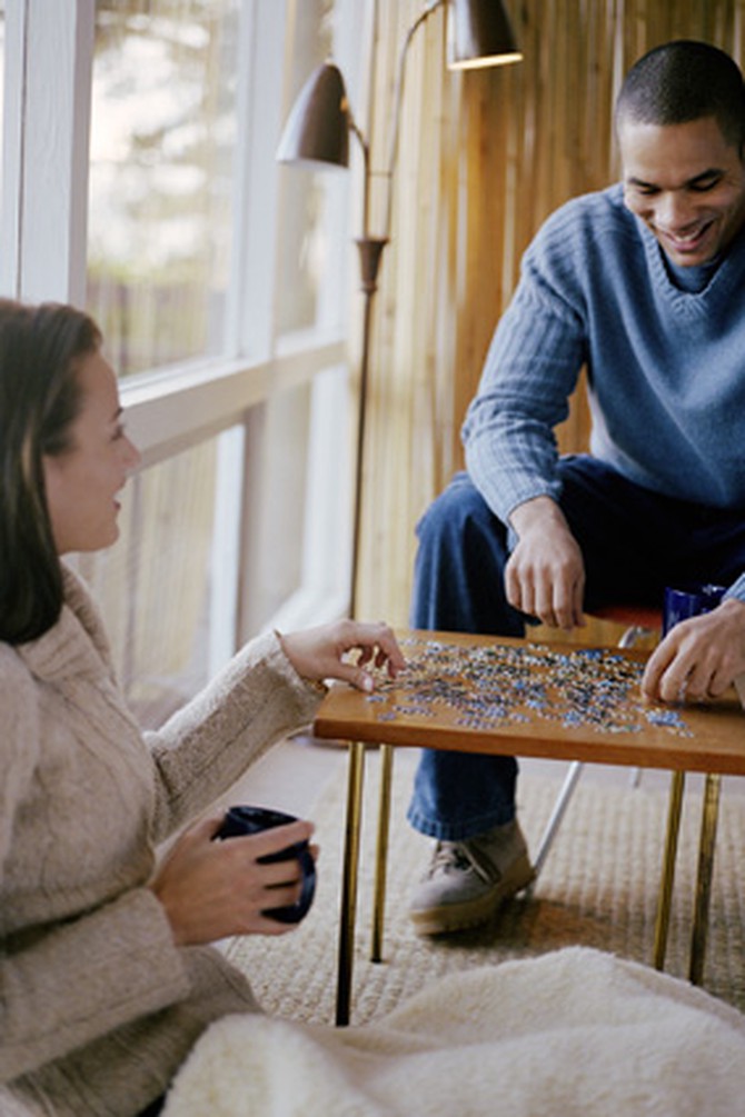 Couple doing puzzle together