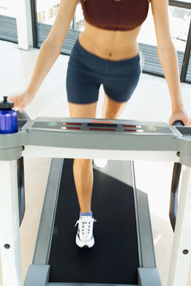 top view of a woman walking on treadmill
