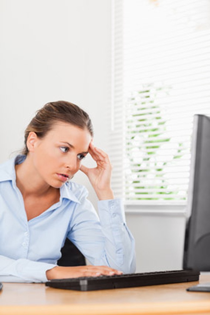 Woman looking up stressful information online