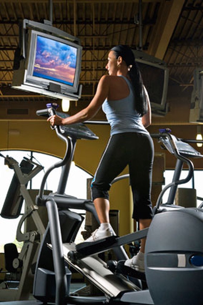Woman watching tv on treadmill
