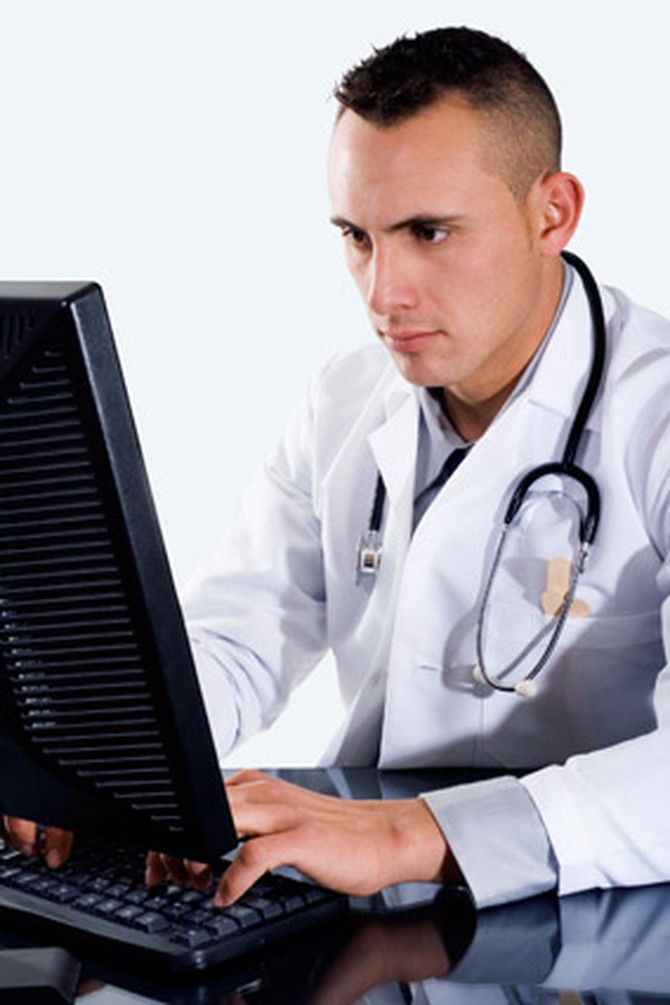 Male doctor at a computer