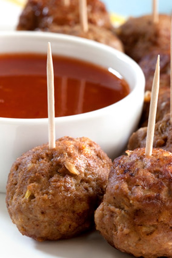 Meatballs with toothpicks and sauce