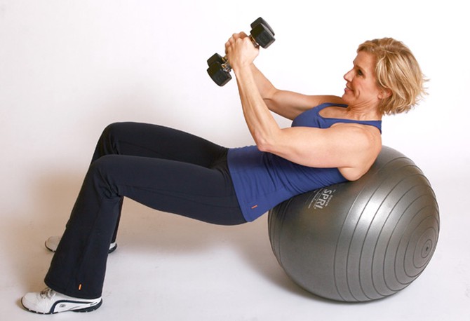 Andrea Metcalf demonstrates the oblique twist exercise.