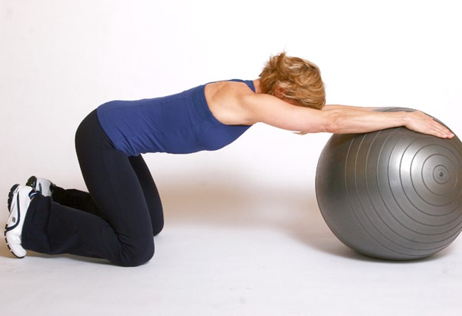 Andrea Metcalf demonstrates the side oblique roll exercise.