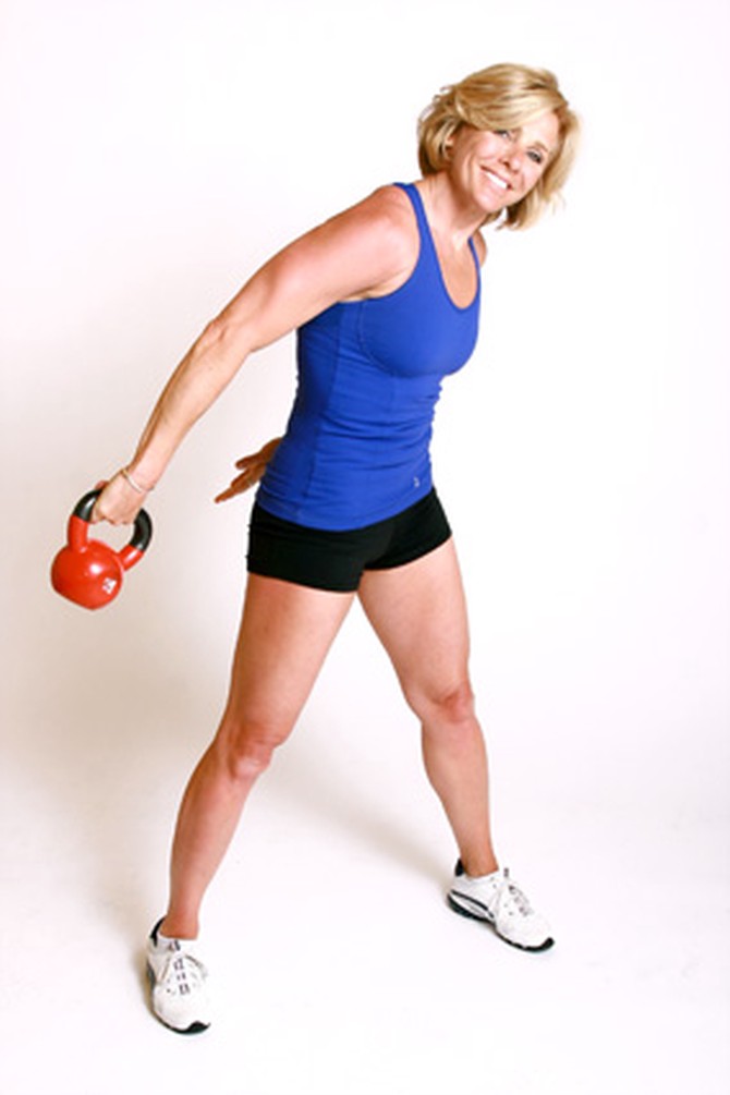 Andrea Metcalf demonstrates how to do the kettle circle exercise using a kettlebell.