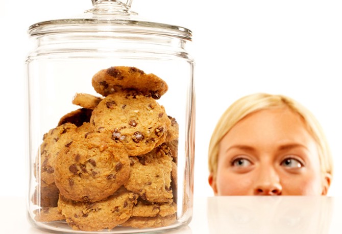 Woman staring at cookie jar