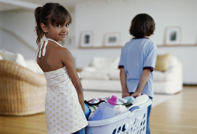 Kids carrying laundry basket