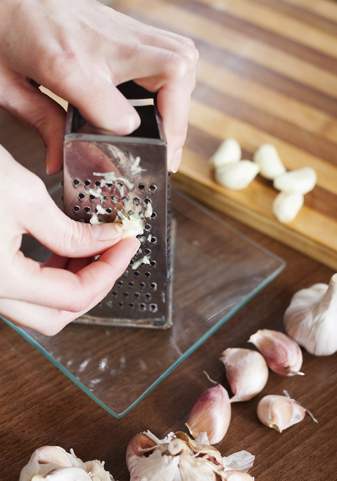 Mincing garlic with a grater