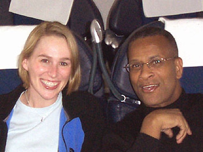 Carri and friend on the plane to South Africa.
