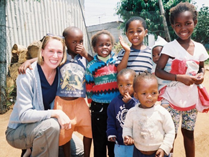 Carri poses with some of the children from the Jembizweni Daycare Center