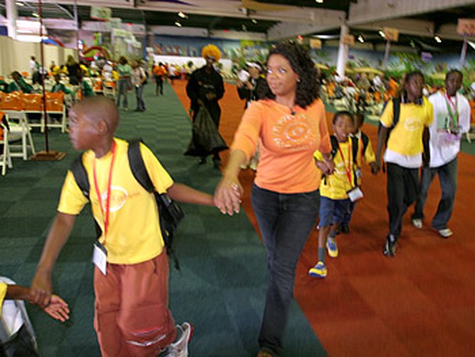 Oprah greets the children arriving for the carnival.