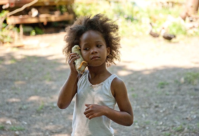 Quvenzhane Wallis holding up a chick in Beasts of the Southern Wild