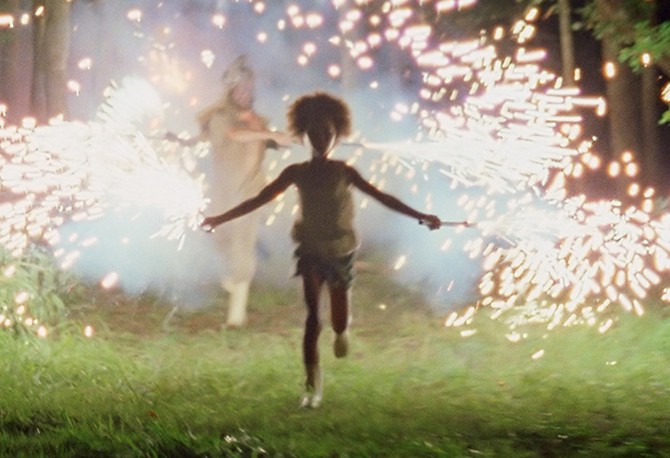 Quvenzhane Wallis running with sparklers in Beasts of the Southern Wild