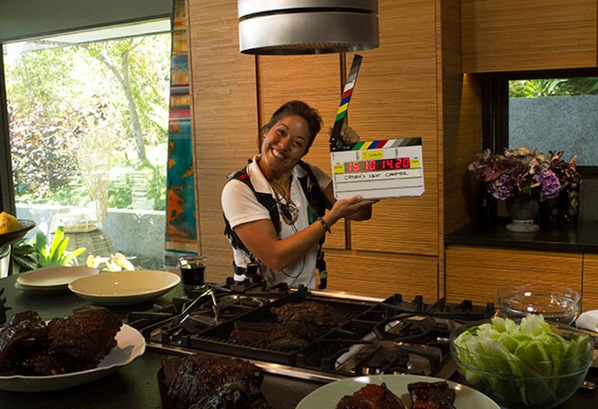 Kristen slates in the kitchen of John Legend and Chrissy Teigen