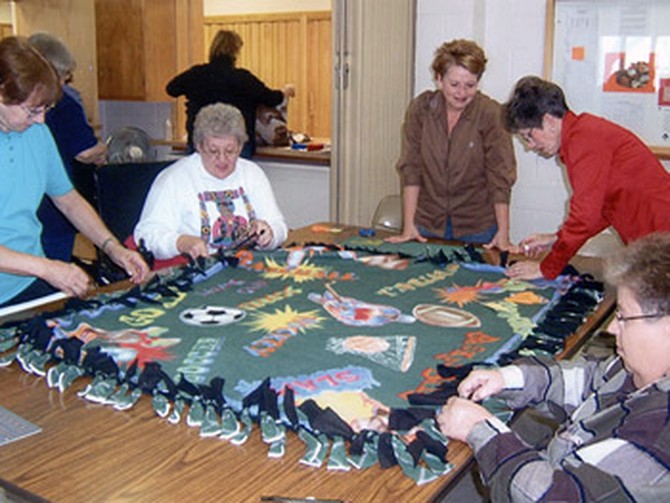Volunteers make blankets in Sumner, Iowa.