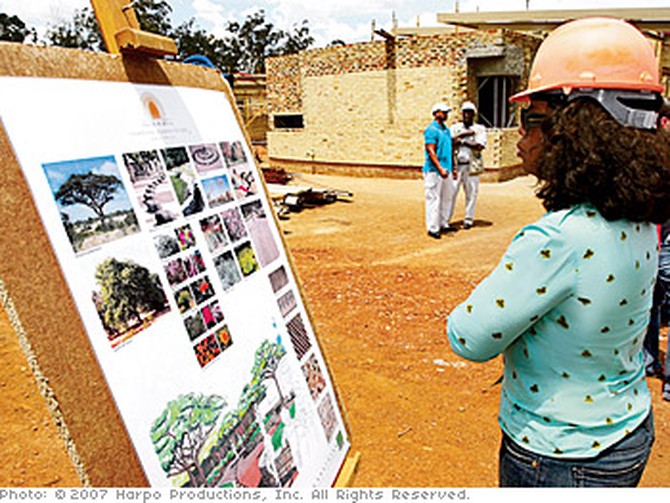 Oprah tours the leadership academy during construction.