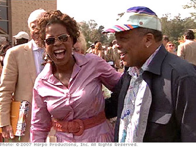 Oprah and Quincy Jones share a laugh at Opening Day.