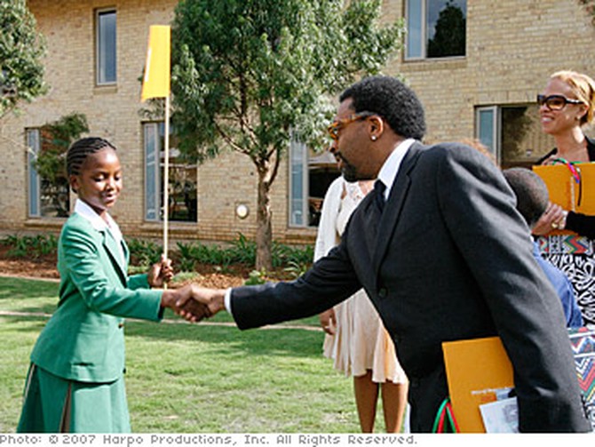 Sade gives Spike Lee a tour of the campus in South Africa.