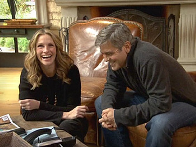Julia Roberts and George Clooney talk to Brad Pitt.