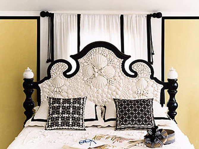 Seashell encrusted headboard and throw pillows from a Moroccan wedding tapestry
