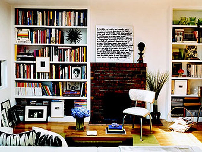 Thelma Golden's living room with built-in bookshelves