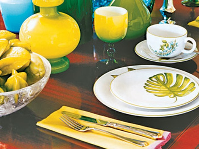 Tableware compliments the dining room's hues.