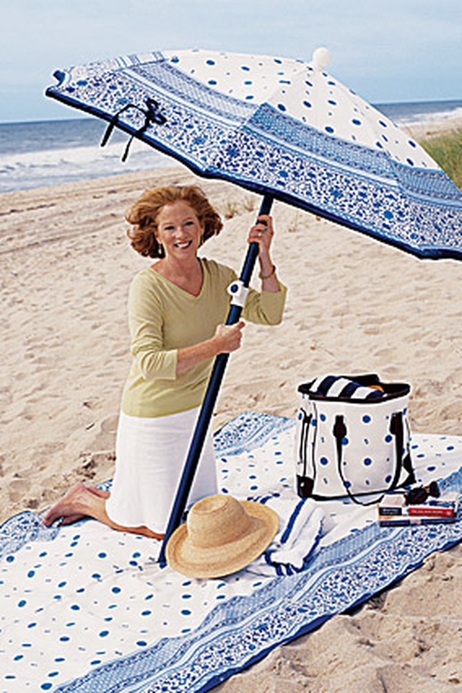 Barbara Tanner holds her fashion beach umbrella