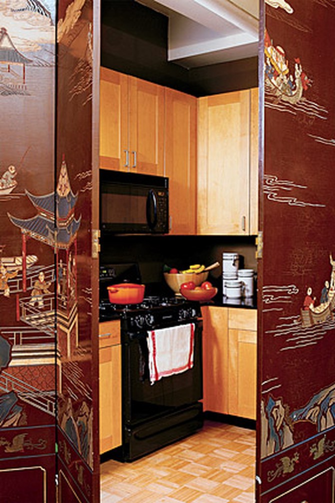 A ten-panel, handpainted chinoiserie screen separates the kitchen from the living room.