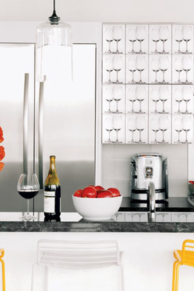 We dressed up the kitchen cabinets with photographs of Riedel stemware printed on adhesive paper.