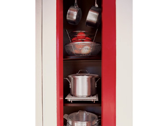 The pantry frame is painted cherry red.