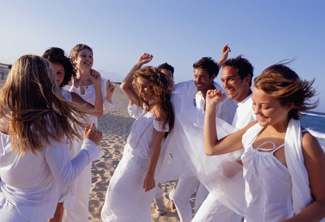 People dancing on the beach
