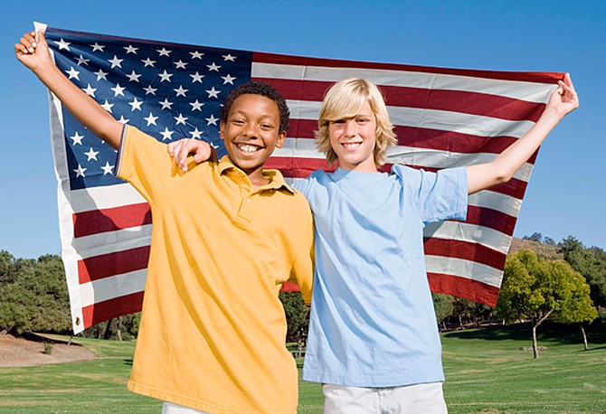 Two kids with an American flag