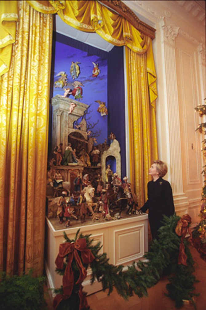 Hillary Clinton gazes at the recently restored White House Creche. .