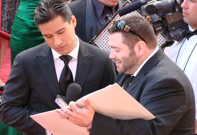 Mario Lopez works with one of his producers.
