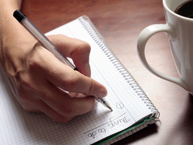 Woman writing to-do list