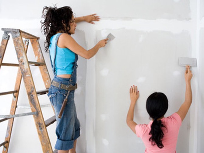Women painting walls