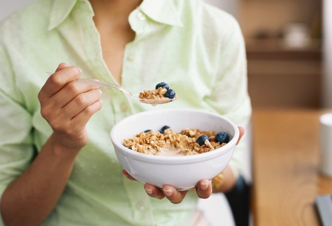 Woman eating healthy breakfast