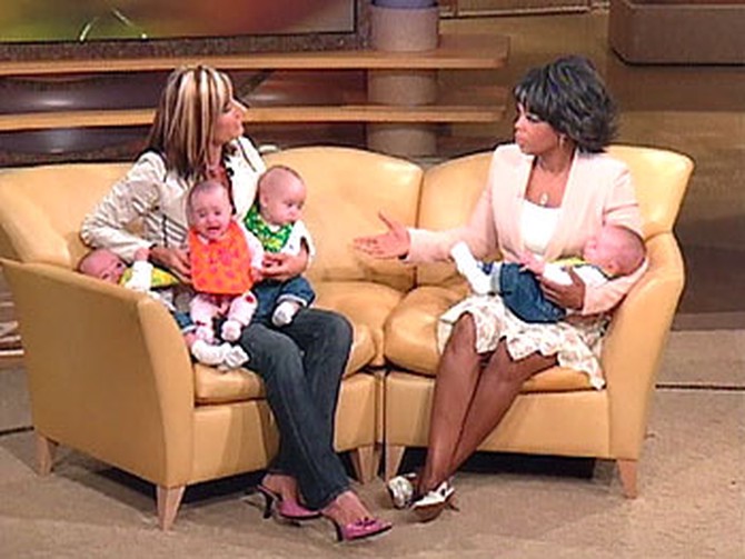 Beth Goodman and Oprah with the quads
