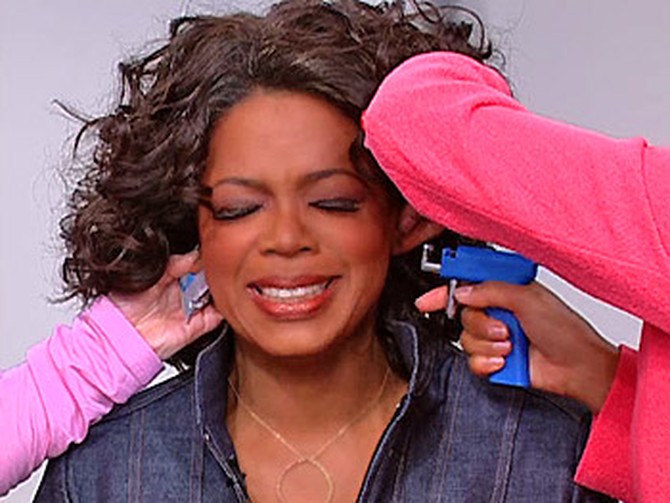Oprah gets her ear pierced