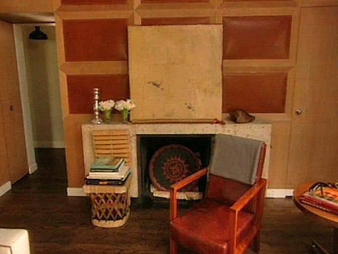 Nate Berkus added leather with baseball stitching to the wood paneling in his library.