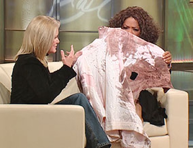 Oprah holds Mary Jo's blood-soaked jacket