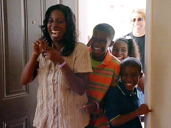 Danielle and her kids see their new home.